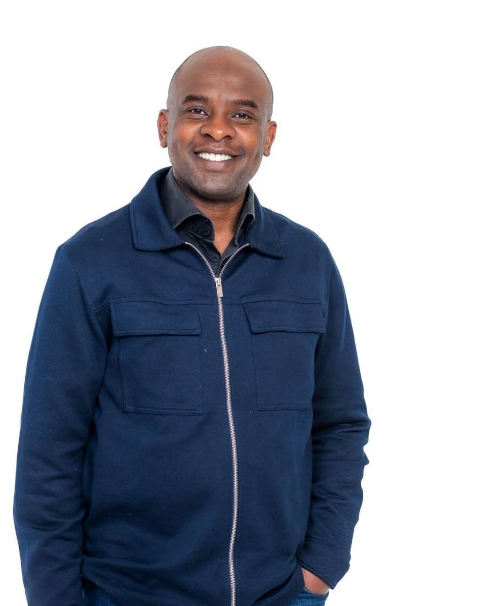 Portrait photograph of Eyitayo Olotu, Co-Founder of RockTower Homes, against a plain background.